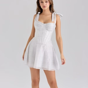 Polka dot white chiffon mini dress with bow straps and corset waist design