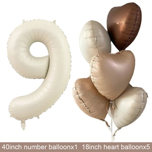 Detail of cream 40 inch number 9 balloon and heart balloons set for party decor