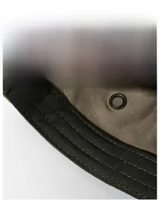 Close-up of the moisture-wicking sweatband and breathable eyelet inside the military cap