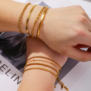 Detailed view of assorted 18K gold plated stainless steel chain bracelets for women