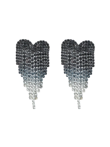 Detail of rhinestone heart earrings with long gradient blue tassels in a macro view