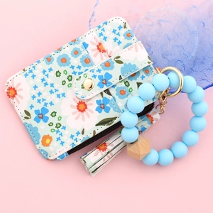 Light blue floral silicone bead bracelet with matching leather card wallet and keychain