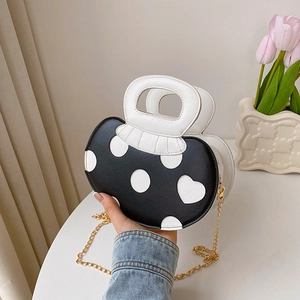 Fashionable black and white polka dot mushroom handbag with heart pattern and chain strap
