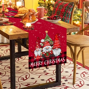 Christmas table runner with festive gnomes and Merry Christmas text on red background