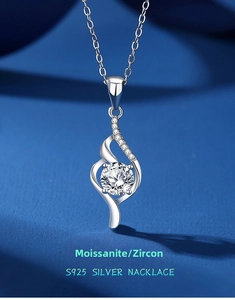 Macro detail of S925 sterling silver necklace featuring a wavy pendant with a sparkling moissanite