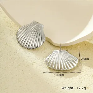 Elegant fan-shaped shell studs in silver titanium steel with radial textures for women