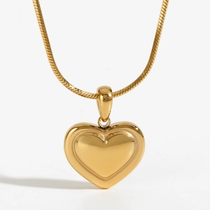 Polished gold heart pendant necklace featuring a minimalist snake chain design