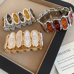 Retro wide elastic enamel bracelet with oval stitching and geometric patterns
