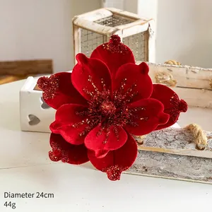 Detail of a 24cm red velvet Christmas flower with golden glitter and sequins