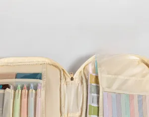 Macro view of interior storage pockets with clear slots and mesh organizers