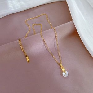 Elegant gold titanium steel V-shaped necklace with a sparkling round zircon pendant