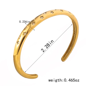 Elegant 18K gold-plated star bangle with sparkling cubic zirconia in 45-degree view