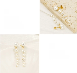 Detailed view of long 18K gold plated tassel earrings with gradient pearl drops and polished finish