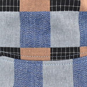 Detailed close-up of plaid cotton linen fabric texture and stitching on sun hat