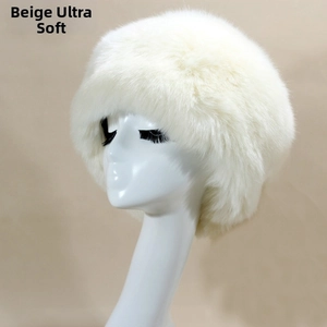 Detailed macro view of super soft beige faux fur material on winter Russian hat