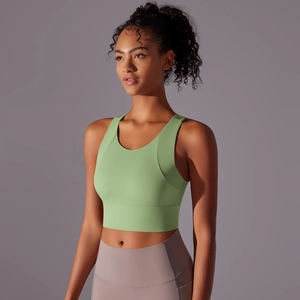 Close-up of avocado green sports bra showing refined fabric texture and racerback design