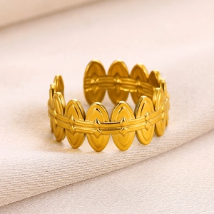 Detail of a 18k gold plated stainless steel ring with vintage geometric oval patterns