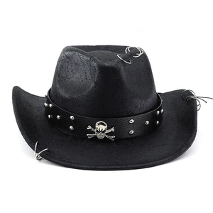 Detail of black faux leather cowboy hat with metal skull badge and punk rivet band