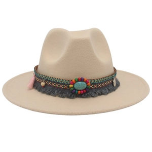 Detail view of beige felt fedora with bohemian turquoise bead and tassel band
