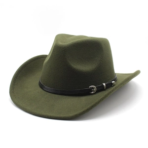 Close-up of army green wool fedora featuring a black band and silver eagle ornament