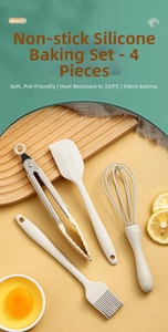 Detail of food grade cream silicone baking set with spatula whisk and tongs on wood