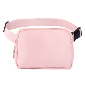 Detailed view of pink nylon waist bag with adjustable strap and durable zipper closure