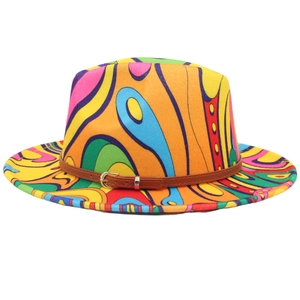 Detailed close-up of a vibrant pop art fedora hat with colorful wave patterns and belt