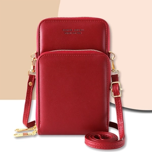 Red PU leather crossbody bag with multiple zip compartments and golden hardware detail