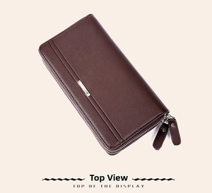 Close-up of brown litchi pattern leather wallet featuring double zippers and metal plaque