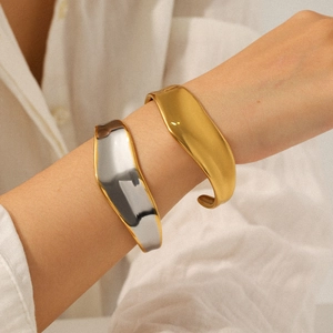 Polished 18K gold stainless steel wide open cuff bracelet with irregular lava texture