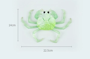 Detailed size view of a green crab toy showing dimensions 22.5cm width and 14cm height