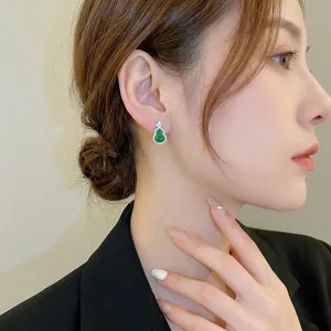 Chinese style gourd stud earrings with emerald green stone and sparkling zircon border