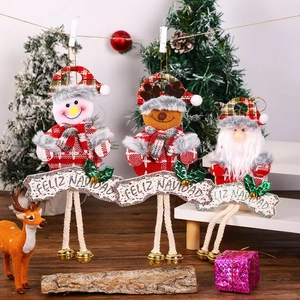 Hanging fabric Christmas ornaments featuring Santa, Snowman, and Reindeer with festive bells