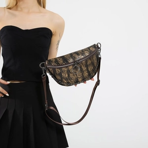 Dark brown skull print waist bag with adjustable strap and decorative metal chain