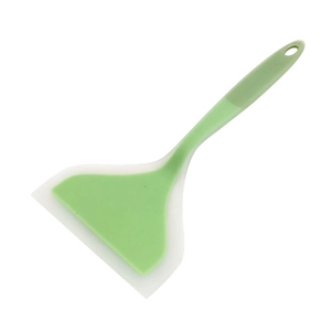Green silicone spatula with translucent edge and hanging hole on a white background