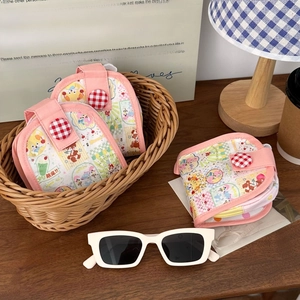 Close-up of a pink cartoon canvas coin purse featuring a multi-layer storage design