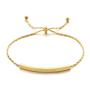 Gold adjustable stainless steel bracelet featuring an engraved Lover Dream curved bar charm