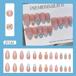 Blue and pink 3D floral press-on nails with shell texture and pearl almond-shaped accents