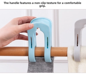 Detail of ergonomic anti-slip grip on heavy-duty plastic quilt clips for drying