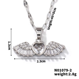 Macro detail of angel wing heart pendant with zircon stones and 1.3x2.3cm measurements