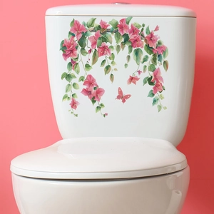 Detail of floral toilet sticker featuring pink bougainvillea and butterfly on white tank