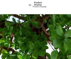 Close-up of realistic green artificial leaves and brown vine textures for home decor