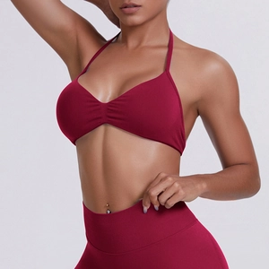 Detailed close-up of seamless burgundy high-elastic sports bra and yoga leggings texture