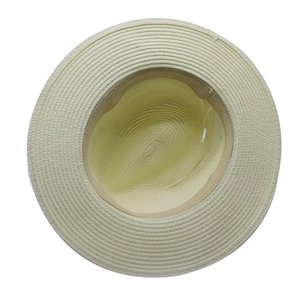 Detailed top view of light beige straw hat showing dense spiral weaving and inner sweatband