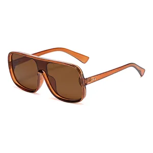 Fashionable tea-tinted oversized one-piece lens sunglasses with a translucent wide frame