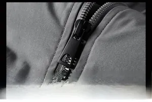 Macro shot of durable black zip fastener on winter padded jacket with windproof fabric