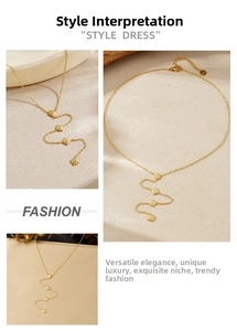 Detail of gold star pendant necklace with layered sparkling starbursts and lobster clasp