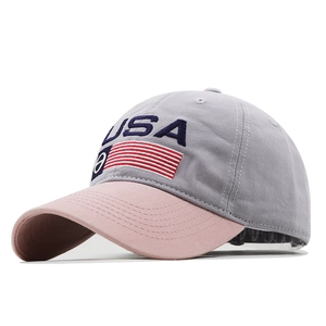Gray and pink USA baseball cap with flag embroidery shown from a 45-degree angle