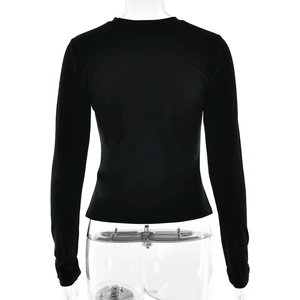 Rear view detail of black slim-fit long-sleeve T-shirt with smooth fabric texture