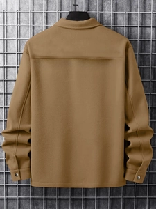Rear view of men's tan corduroy jacket featuring classic yoke and metallic buttoned cuffs